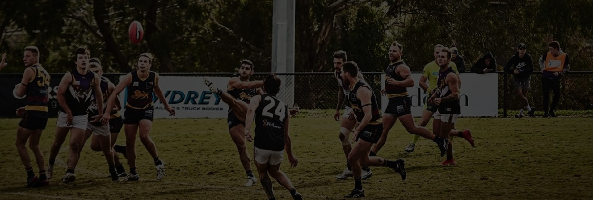 Australian Rules football players on ground